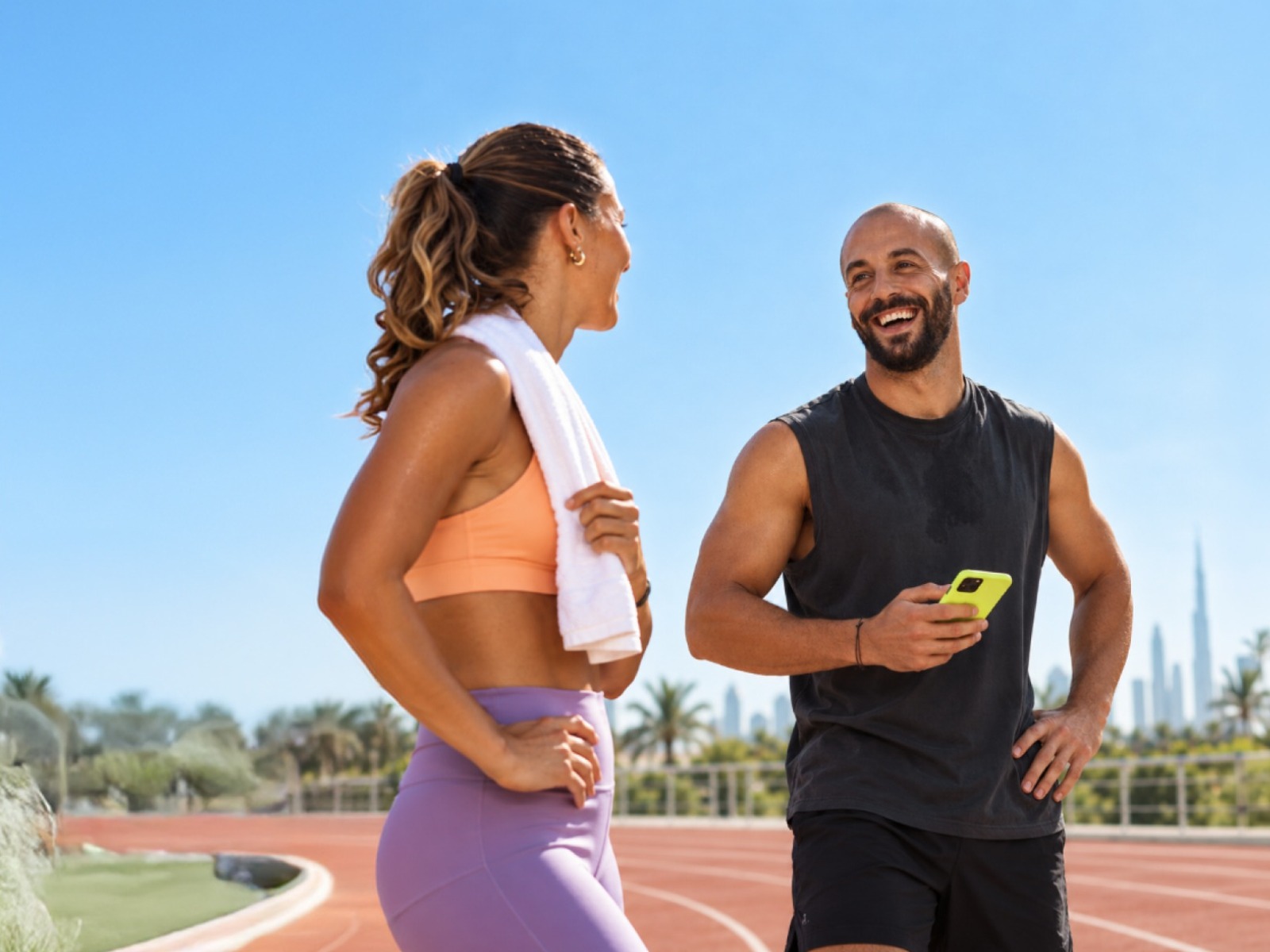 Couple chatting on a running track
